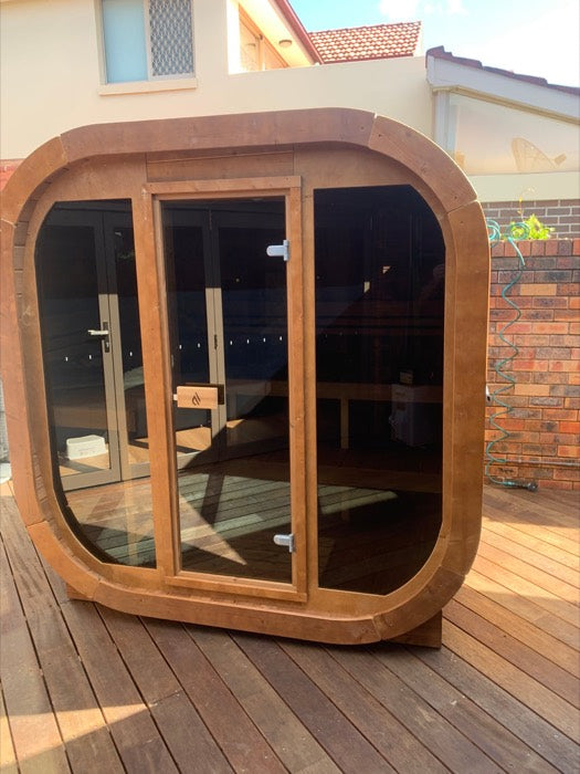 Timber sauna on a hardwood deck